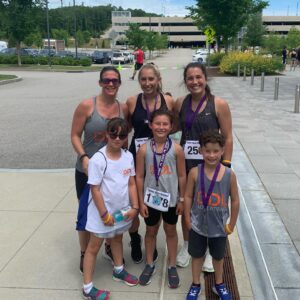 Stacey, Mckenzie, & Natalia from DDL posing after running the Angels Giving Back 5k